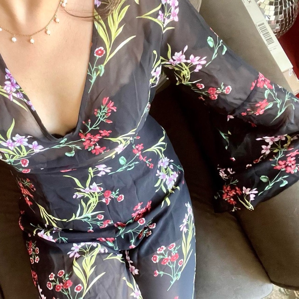 Sheer floral jumpsuit with bell sleeves